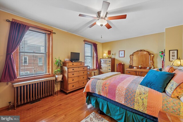 3257 Almond St, Philadelphia, PA 19134 - bedroom with radiator heating unit, wood finished floors, and ceiling fan