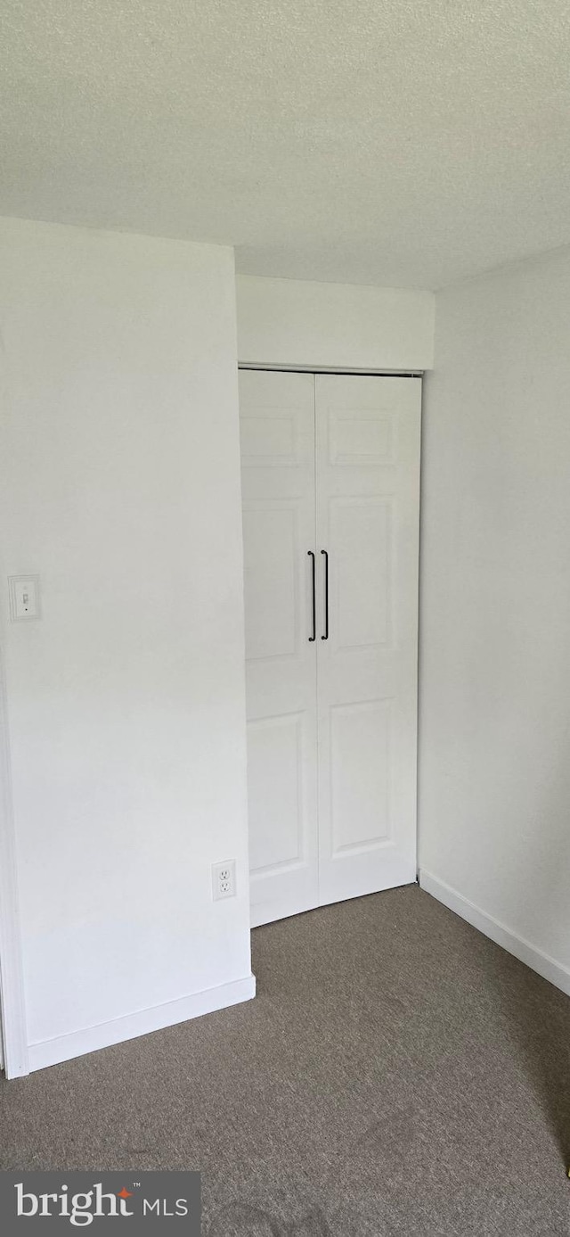 626 Felton Ave, Sharon Hill, PA 19079 - unfurnished bedroom with a textured ceiling, carpet, a closet, and baseboards