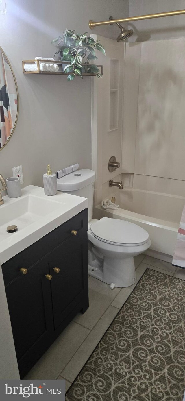 626 Felton Ave, Sharon Hill, PA 19079 - bathroom featuring shower / bathtub combination, vanity, tile patterned flooring, and toilet