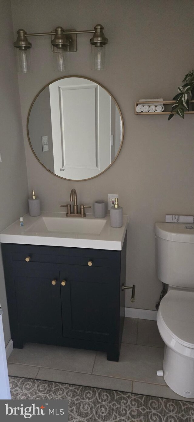 626 Felton Ave, Sharon Hill, PA 19079 - half bathroom with tile patterned floors, baseboards, vanity, and toilet
