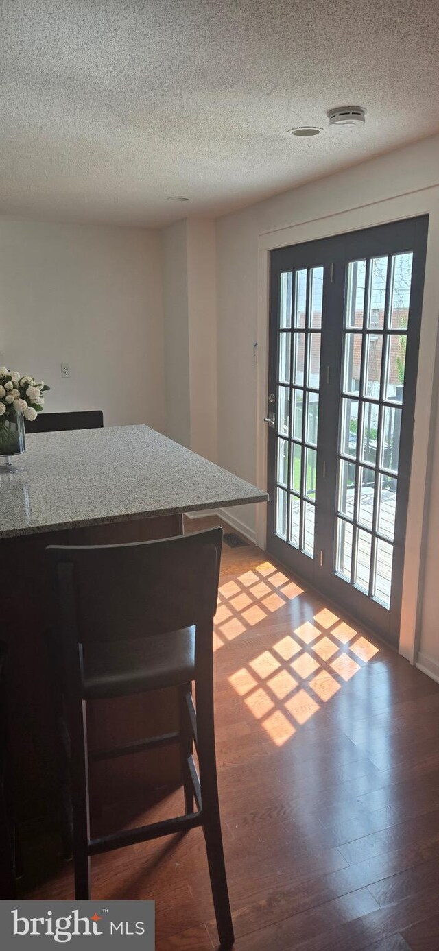 626 Felton Ave, Sharon Hill, PA 19079 - doorway to outside featuring wood finished floors and a textured ceiling
