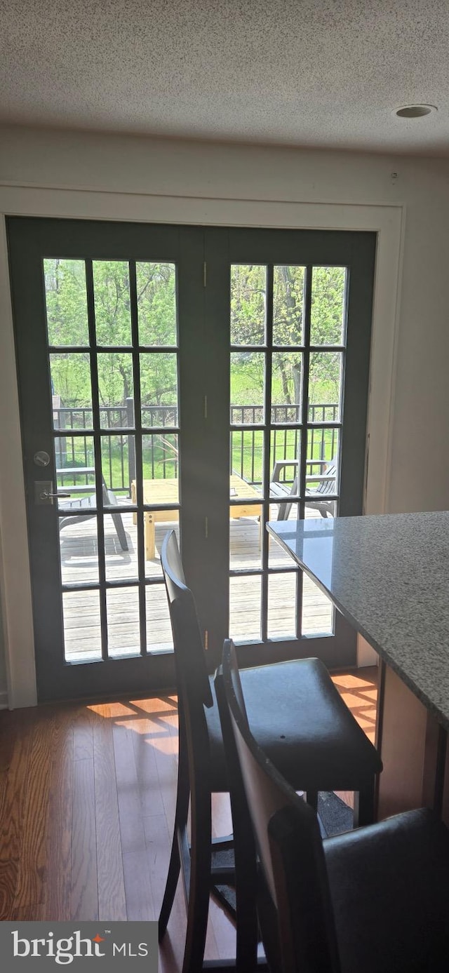 626 Felton Ave, Sharon Hill, PA 19079 - dining room with a wealth of natural light, wood finished floors, and a textured ceiling