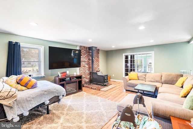 living room with plenty of natural light, recessed lighting, and wood finished floors