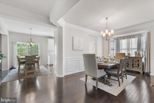 10815 Flying Change Ct, Upper Marlboro, MD 20772 - dining room with a wainscoted wall, dark wood-style floors, ornamental molding, and an inviting chandelier