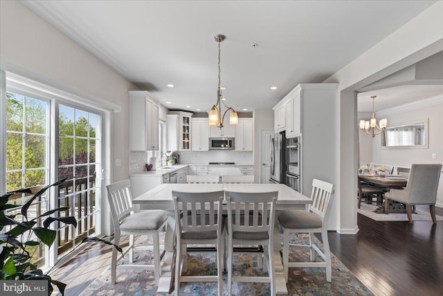 10815 Flying Change Ct, Upper Marlboro, MD 20772 - dining room featuring a chandelier, dark wood-style flooring, and recessed lighting