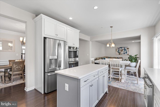 10815 Flying Change Ct, Upper Marlboro, MD 20772 - kitchen featuring a chandelier, light countertops, dark wood-style floors, and stainless steel appliances