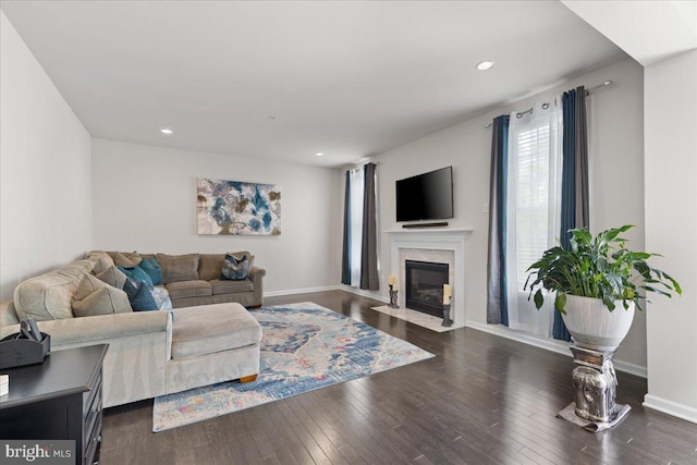 10815 Flying Change Ct, Upper Marlboro, MD 20772 - living room featuring a fireplace with flush hearth, baseboards, dark wood-style floors, and recessed lighting