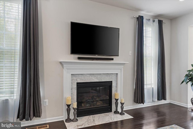 10815 Flying Change Ct, Upper Marlboro, MD 20772 - interior details with a high end fireplace, baseboards, and wood finished floors