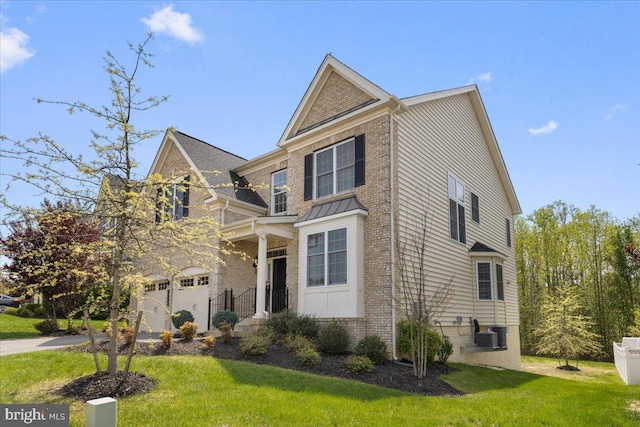 10815 Flying Change Ct, Upper Marlboro, MD 20772 - view of front of house featuring a garage, a front lawn, brick siding, and concrete driveway
