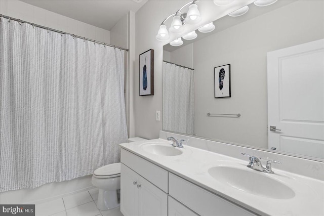 10815 Flying Change Ct, Upper Marlboro, MD 20772 - full bath featuring double vanity, tile patterned floors, toilet, and a sink