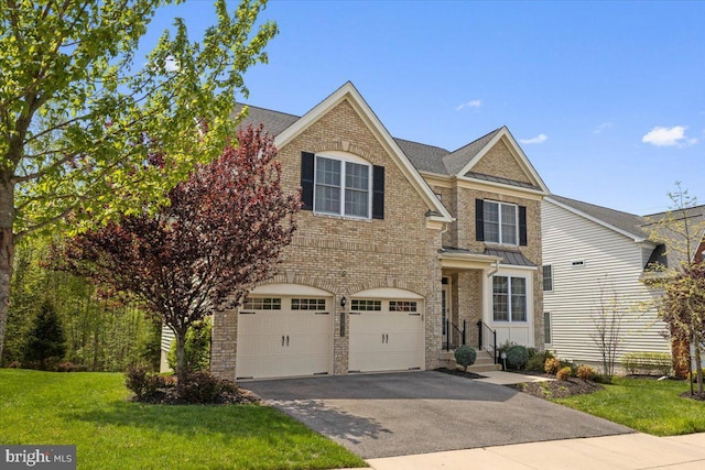 10815 Flying Change Ct, Upper Marlboro, MD 20772 - traditional home with brick siding, a garage, a front yard, and aphalt driveway