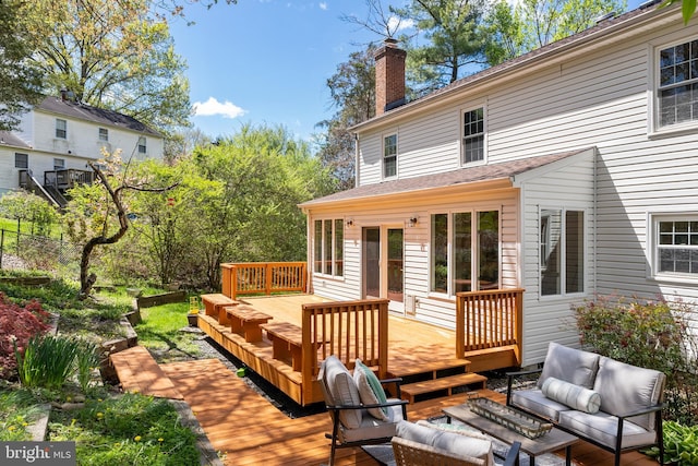 wooden terrace featuring outdoor lounge area