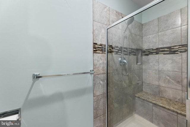 bathroom with a shower stall