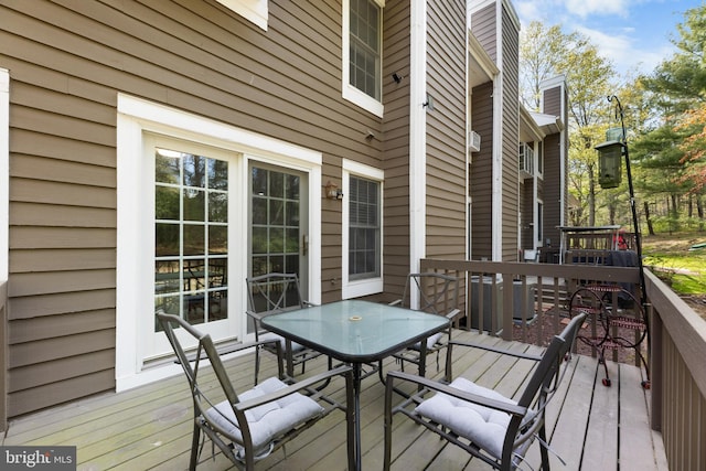 deck with outdoor dining area