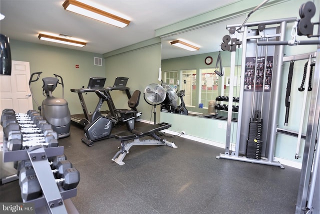 gym with baseboards and visible vents