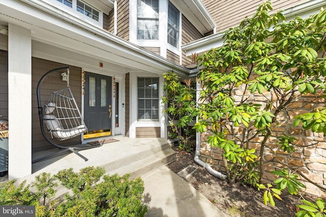 property entrance with covered porch