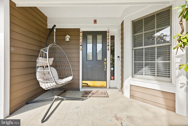 doorway to property with covered porch