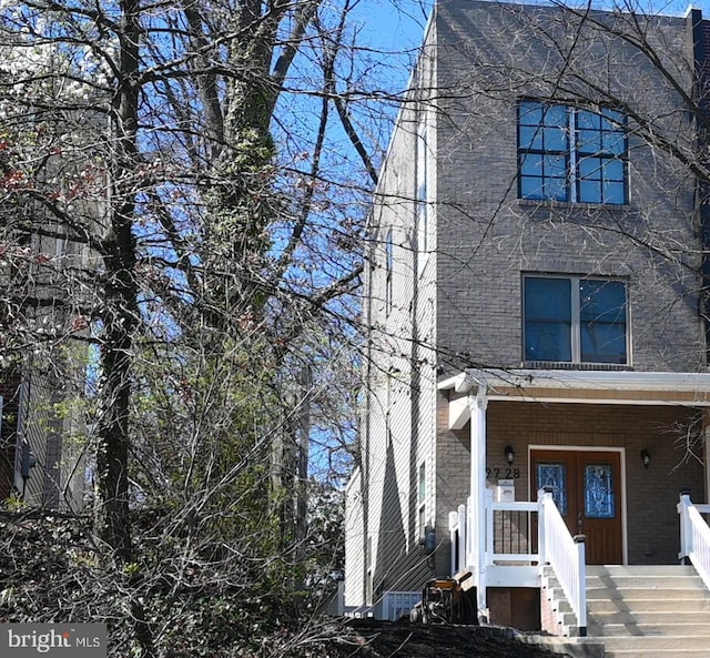traditional home featuring covered porch