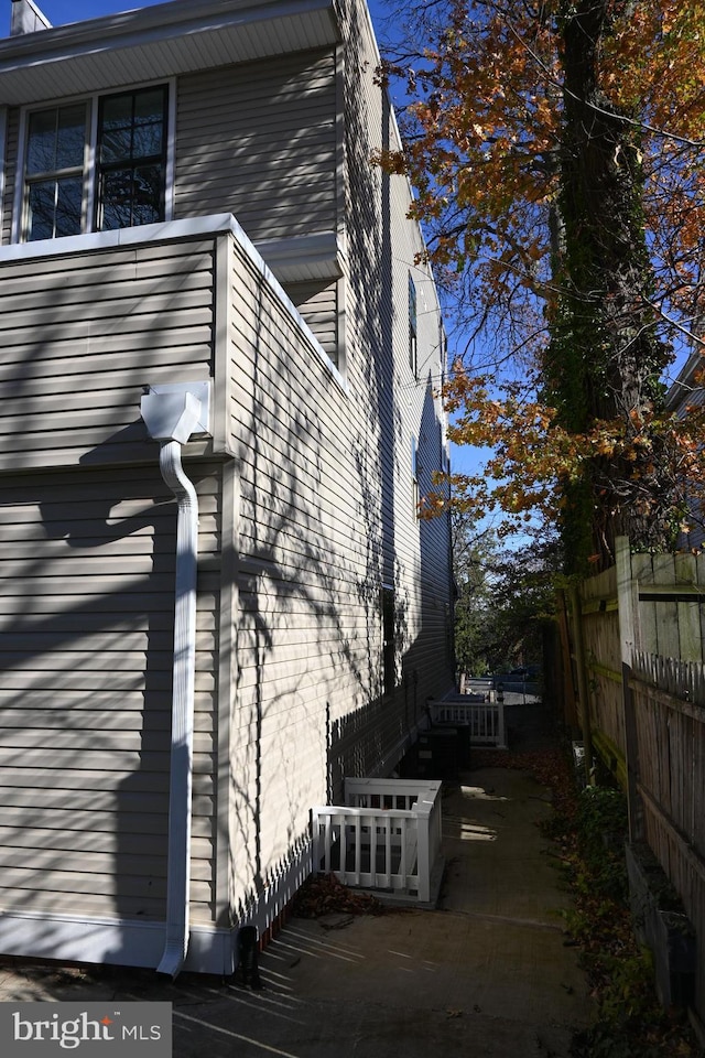 view of home's exterior with fence