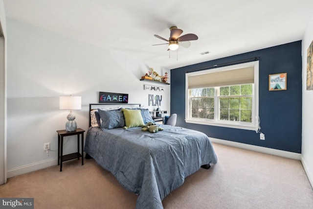 bedroom with visible vents, ceiling fan, carpet flooring, and baseboards