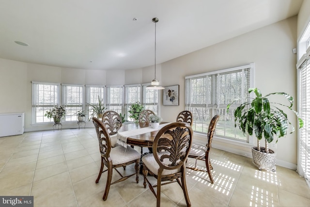 dining space with light tile patterned flooring