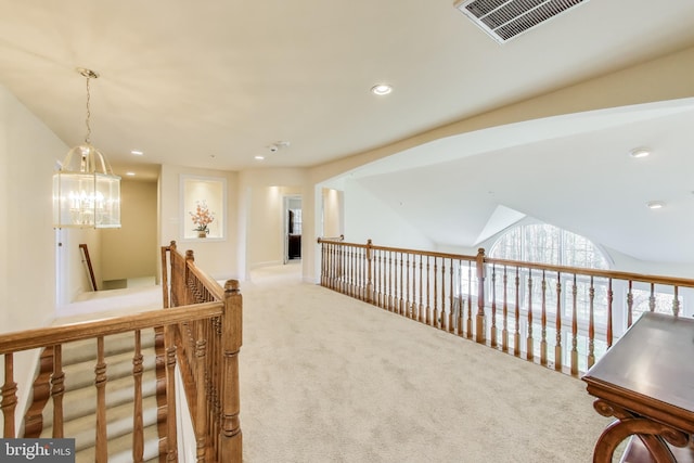 corridor with recessed lighting, carpet, vaulted ceiling, visible vents, and an upstairs landing
