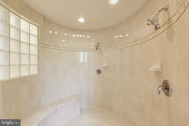 bathroom featuring recessed lighting and a tile shower