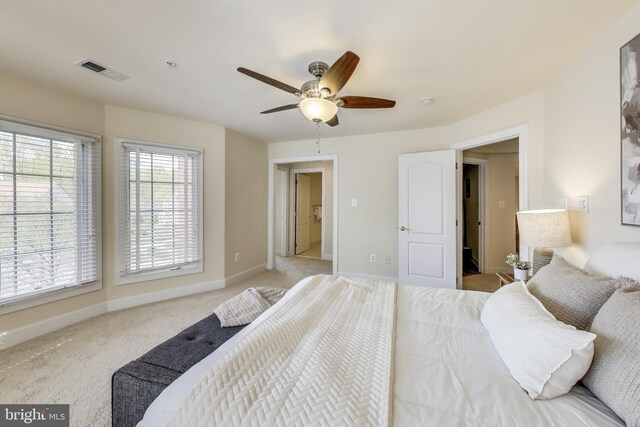 bedroom with baseboards, visible vents, carpet flooring, and ceiling fan