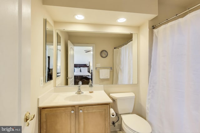 bathroom with recessed lighting, ensuite bath, toilet, and vanity
