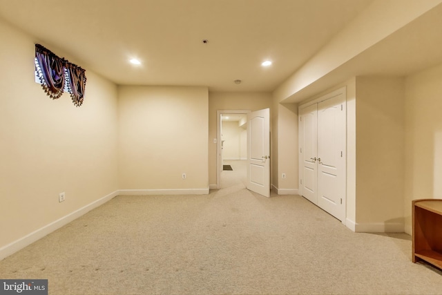 unfurnished bedroom featuring baseboards, recessed lighting, and light colored carpet