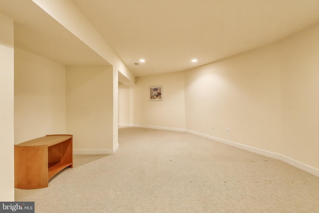 finished below grade area featuring baseboards, carpet floors, and recessed lighting