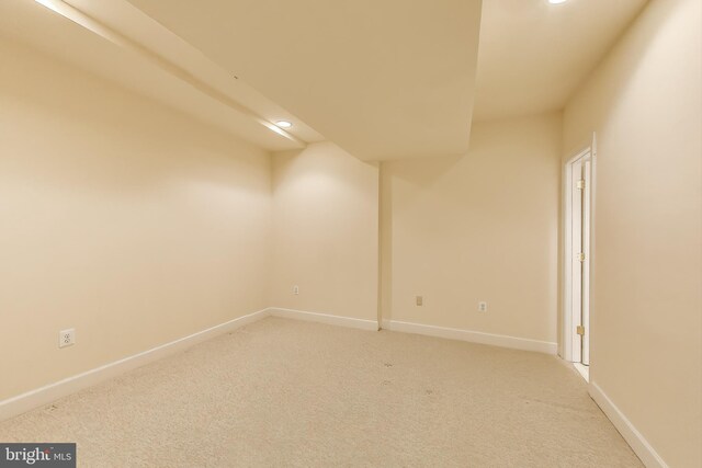 unfurnished room featuring baseboards, recessed lighting, and light colored carpet