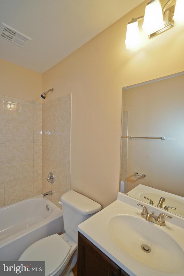 full bath with visible vents, shower / washtub combination, toilet, and vanity