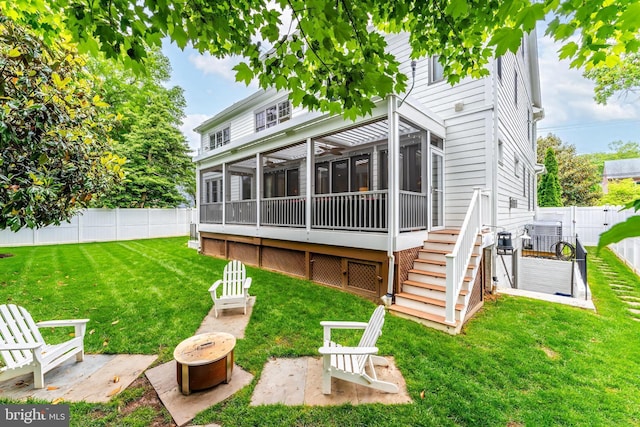 620 N Lincoln St, Arlington, VA 22201 - back of house with a sunroom, stairway, a fire pit, a wooden deck, and a patio