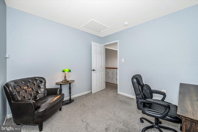 carpeted office space featuring baseboards and attic access