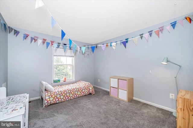 carpeted bedroom featuring baseboards