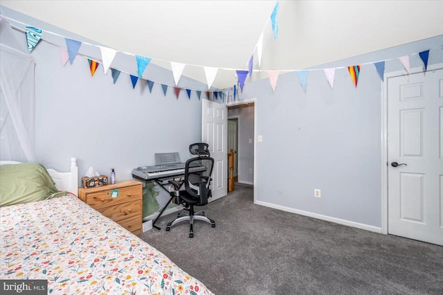 carpeted bedroom featuring baseboards