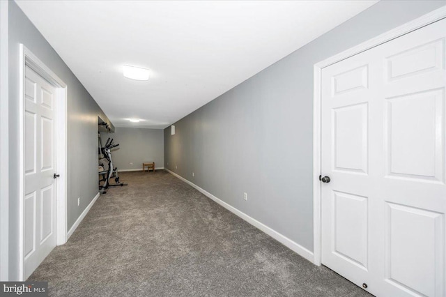 workout room with carpet flooring and baseboards