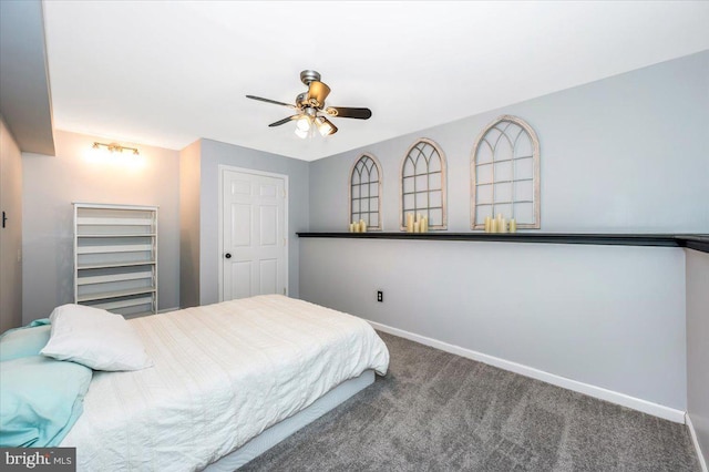 carpeted bedroom with baseboards and a ceiling fan
