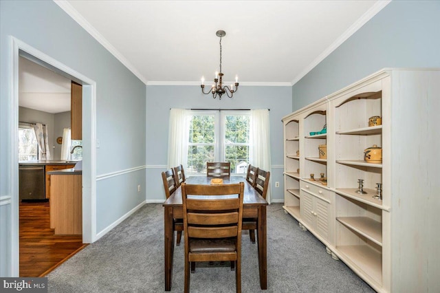 carpeted dining room with a wealth of natural light, an inviting chandelier, and crown molding