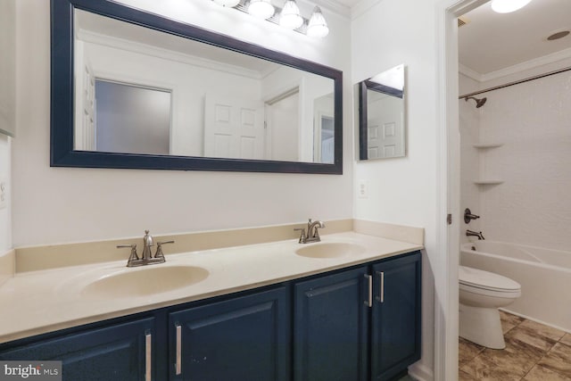 bathroom featuring crown molding, a sink, double vanity, and toilet