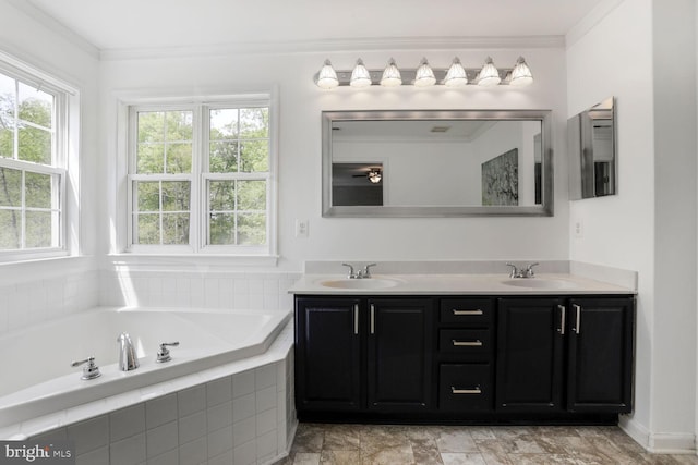 bathroom with double vanity, ornamental molding, a sink, and a garden tub