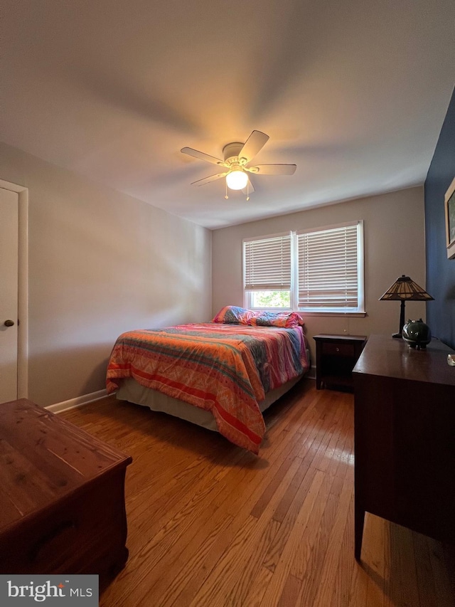 bedroom featuring light wood-style floors and ceiling fan