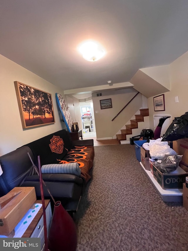 carpeted living area with stairway