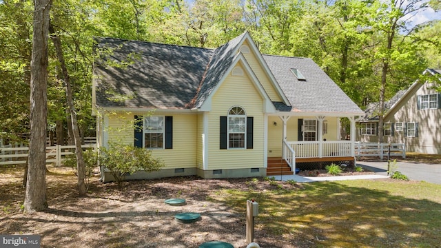 111 S Newport Way, Dagsboro, DE 19939 - view of front of house featuring a porch, crawl space, fence, and roof with shingles