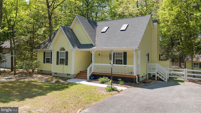 111 S Newport Way, Dagsboro, DE 19939 - view of front of property with a porch, crawl space, fence, and a shingled roof