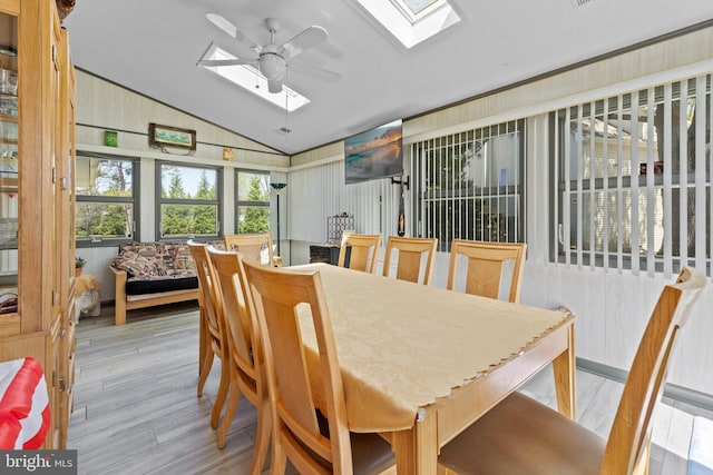 605 Old Post Ct, Bethany Beach, DE 19930 - dining area featuring lofted ceiling with skylight, wood finished floors, and ceiling fan