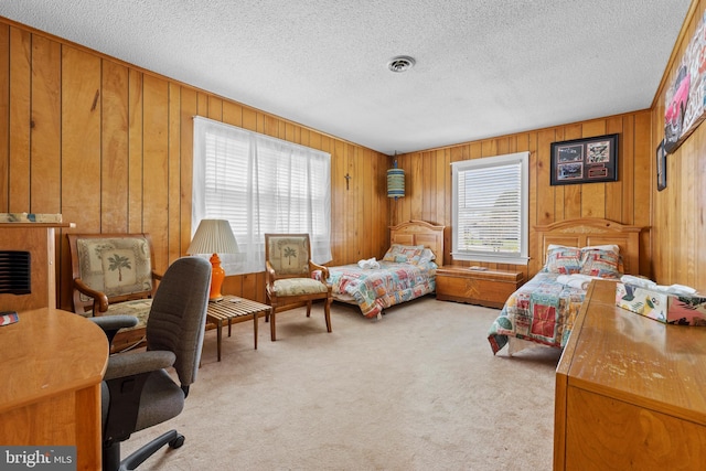 605 Old Post Ct, Bethany Beach, DE 19930 - bedroom featuring visible vents, a textured ceiling, light colored carpet, and multiple windows
