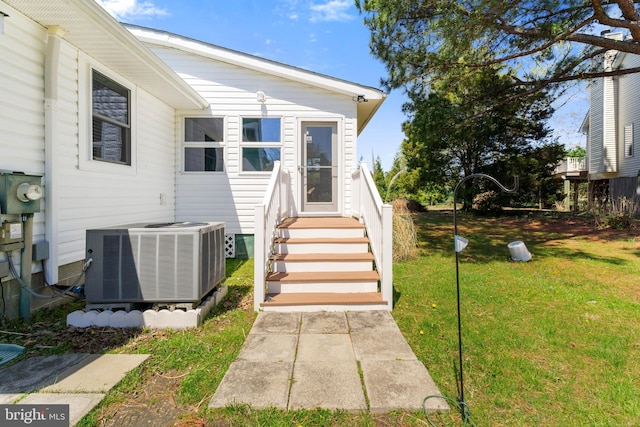 605 Old Post Ct, Bethany Beach, DE 19930 - doorway to property with a yard and central AC unit