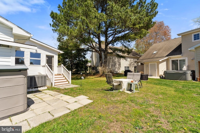 605 Old Post Ct, Bethany Beach, DE 19930 - view of yard featuring central AC unit and a hot tub
